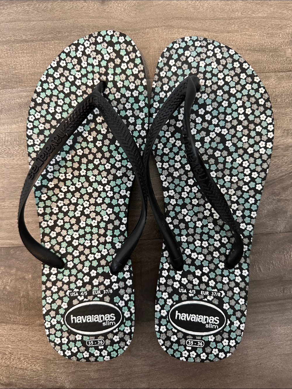 Havaianas Slim Floral Flip Flops in Black and Mint